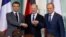 French President Emmanuel Macron, German Chancellor Olaf Scholz, and Polish Prime Minister Donald Tusk pose at a press conference in Berlin on March 15.