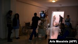 NAGORNO-KARABAKH -- Paramedics and volunteers work in the basement of a medical center outside the city of Stepanakert, October 14, 2020