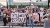 Protesters hold a banner reading "I'm/We're Furgal" as they attend a mass rally in support of Governor Sergei Furgal in Khabarovsk on July 16.