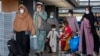 Families evacuated from Kabul, Afghanistan walk through the terminal after they arrived at Washington Dulles International Airport in September 2021. (file photo)