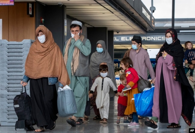 Families evacuated from Kabul arrive in Washington, D.C., in September 2021.