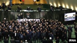 Iran lawmakers chanting "Down With America" on Parliament floor. January 7, 2020.