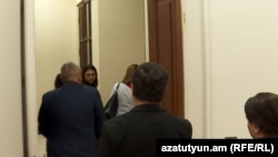 Armenia - Government officials and pro-government lawmakers walk out of a meeting at the National Assembly, September 23, 2026.