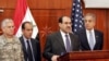 Iraqi Prime Minister Nuri al-Maliki (center) announcing the killing of al-Zarqawi in Baghdad today