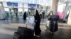 Iranian pilgrims arrive at the Imam Khomeini international airport in Tehran as they return from the hajj in Saudi's holy Muslim city of Mecca, September 29, 2015