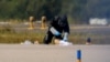 A police officer in protective clothing works at Leipzig/Halle Airport in Schkeuditz, Germany, on August 5.