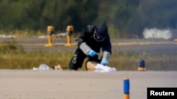 A police officer in protective clothing works at Leipzig/Halle Airport in Schkeuditz, Germany, on August 5.