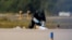 A police officer in protective clothing works at Leipzig/Halle Airport in Schkeuditz, Germany, on August 5.