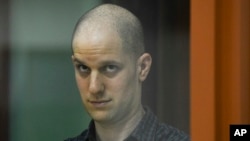 U.S. journalist Evan Gershkovich appears in court in Yekaterinberg on June 26