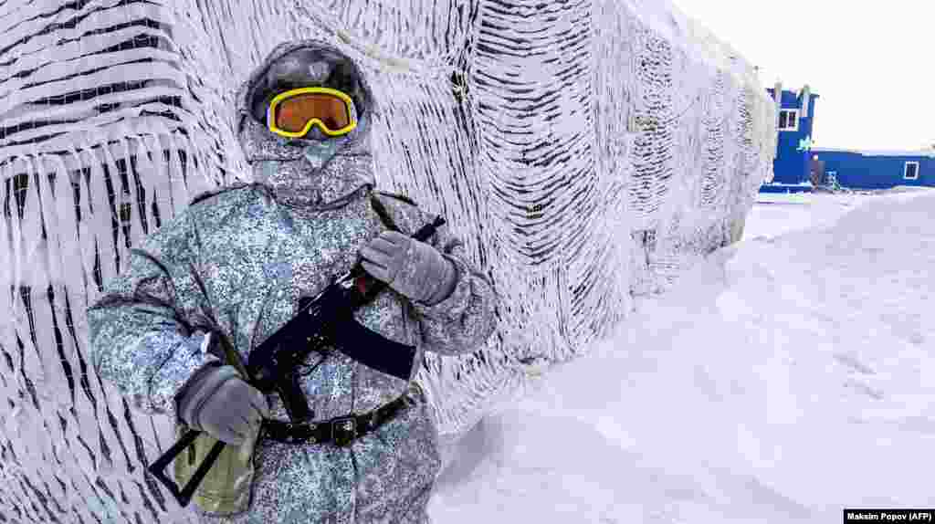 A soldier holds a rifle as he patrols the Russian northern military base on Kotelny Island, beyond the Arctic Circle. (AFP/Maksim Popov)