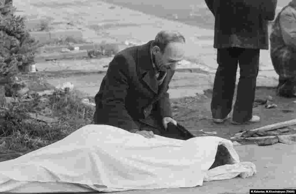 A man grieving over a loved one. The press coverage was devastating for the U.S.S.R. as revelations of reckless construction sent shockwaves through the Soviet public.