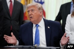 US President Donald Trump speaks during a signing ceremony for the "Secure America Act" in the Oval Office of the White House in Washington on June 10.