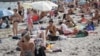 People on a beach in Odesa on August 10.