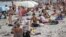 People on a beach in Odesa on August 10.