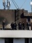 Romania -- Romanian law enforcement officers work on the site of an explosion