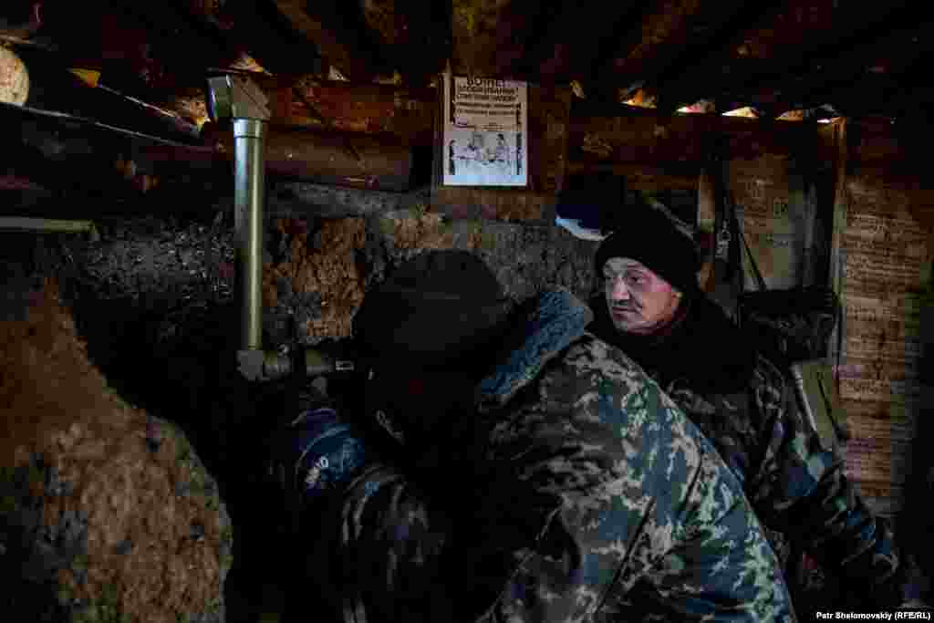 Government troops watch enemy positions.