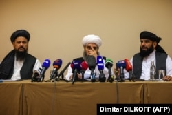 Taliban negotiators Abdul Latif Mansoor (left), Shahabuddin Delawar (center), and Suhail Shaheen (right) attend a press conference in Moscow on July 9.