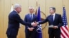 Finnish Foreign Minister Pekka Haavisto (left) shakes hands with U.S. Secretary of State Antony Blinken as NATO Secretary-General Jens Stoltenberg looks on during an accession ceremony at a NATO foreign ministers' meeting in Brussels on April 4. 