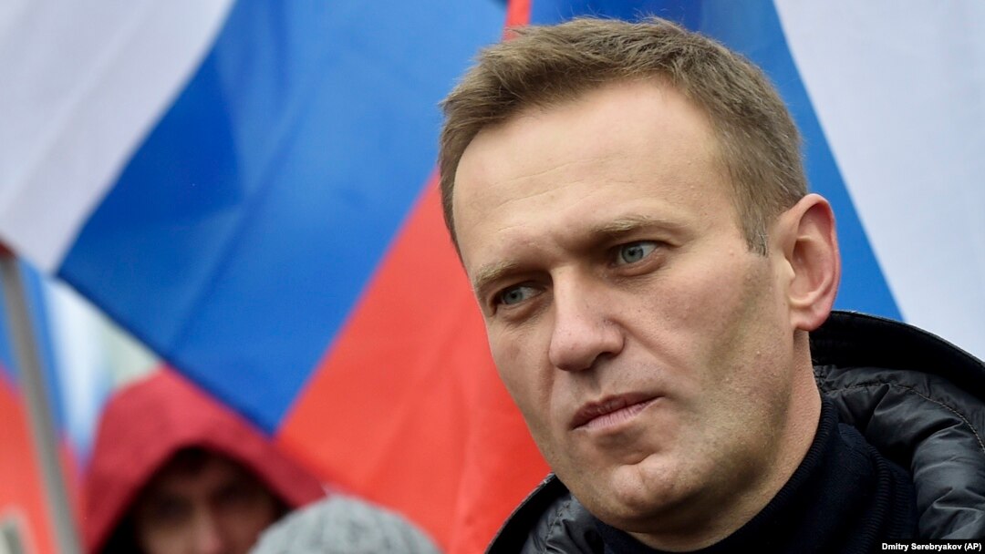 RUSSIA -- In this file photo taken on Sunday, Feb. 24, 2019, Russian opposition activist Alexei Navalny takes part in a march in memory of opposition leader Boris Nemtsov in Moscow, Russia .