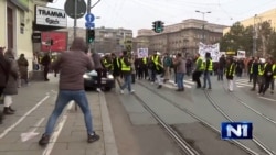 Woman Severely Injured After Car Ploughs Through Protest In Belgrade (WARNING: Viewers may find the content of this video disturbing.)