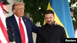 US President Donald Trump greets Ukrainian President Volodymyr Zelenskyy at the White House on August 18, 2025. 