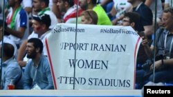 Fans hold a banner supporting Iranian women at a World Cup match in St. Petersburg on June 15.