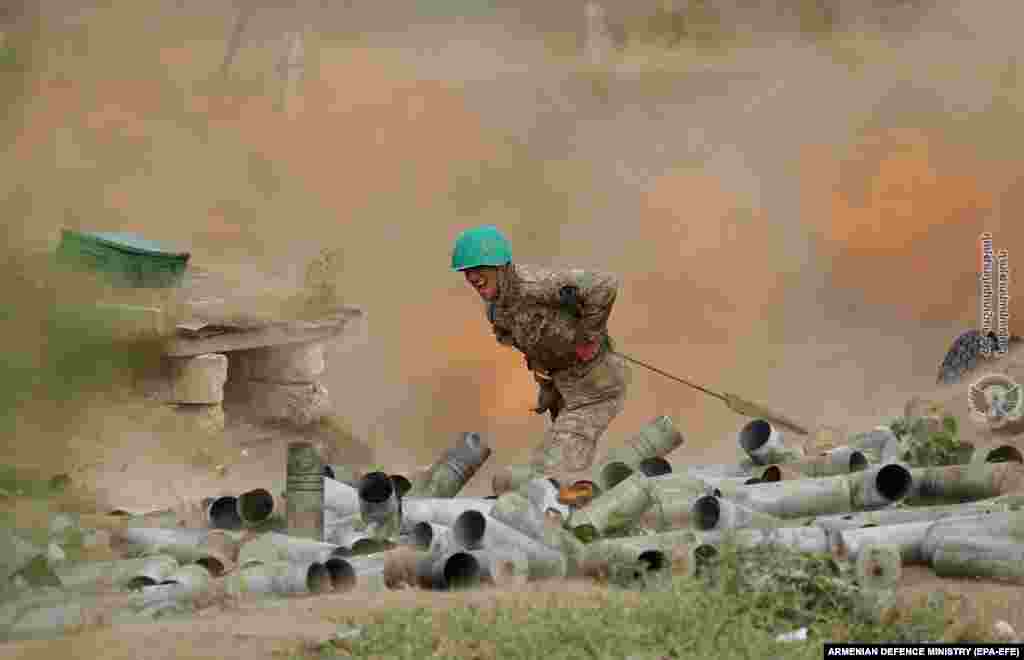 A handout photo made available by the Armenian Defense Ministry on September 30 shows an Armenian soldier during military clashes with Azerbaijani troops along the Line of Contact in the breakaway Nagorno-Karabakh region. (epa-EFE)