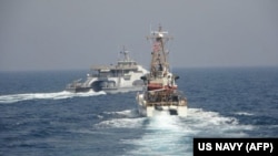 The Iranian Harth 55 (left) conducted an unsafe and unprofessional action by crossing the bow of the Coast Guard patrol boat USCGC Monomoy (right) as the U.S. vessel was conducting a routine maritime security patrol in international waters of the southern Arabian Gulf on April 2, the U.S. Navy said.