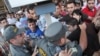 Armenia - Riot police confront youth activists protesting against higher bus fares in Yerevan, 22Jul2013.