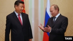 Голова КНР Сі Цзіньпін та президент Росії Володимир Путін, Душанбе, 11 вересня 2014 року