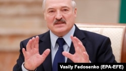 Belarusian President Alyaksandr Lukashenka reacts during a meeting with the media in Minsk on December 14. 