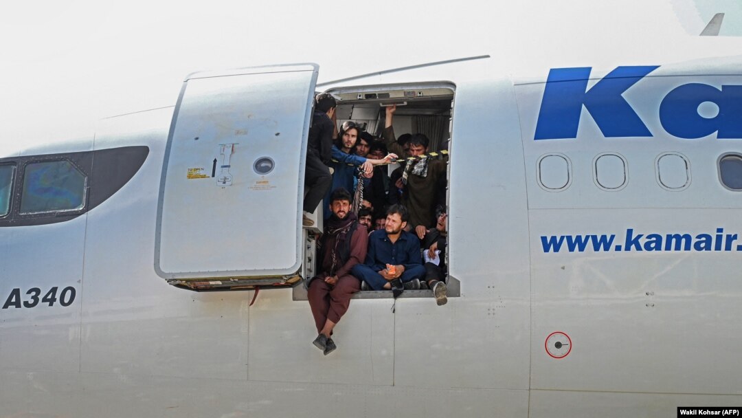 Desperate Afghans cram into a plane at the airport in Kabul in a bid to flee the country on August 16. (file photo)