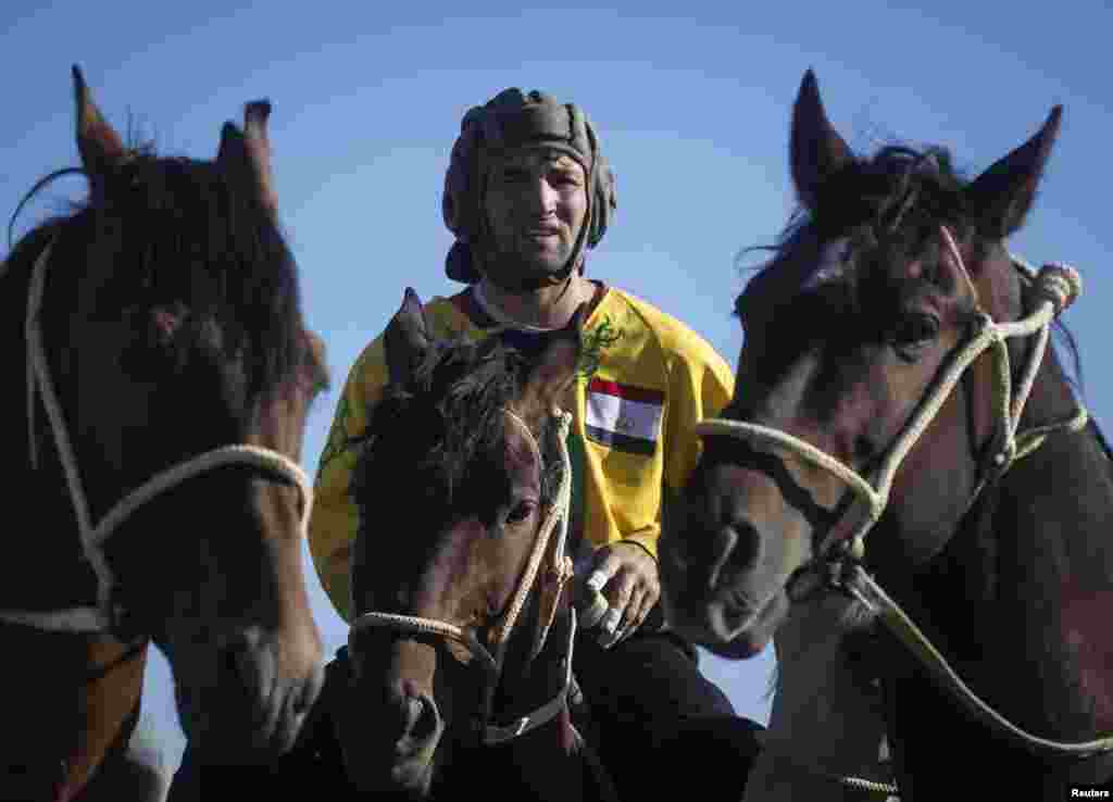 A Tajik rider in the Kazakh capital Astana prepares for a game during the first Asian championships in kokpar, or buzkashi, a traditional Central Asian sport in which teams on horseback attempt to score goals by propelling a headless goat carcass down a field.&nbsp;