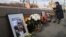 A woman lays flowers at the place where Boris Nemtsov was killed on February 26.