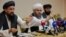 Representatives of the Taliban attend a news conference in Moscow on July 9
