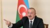 AZERBAIJAN -- Azerbaijani President Ilham Aliyev gestures as he speaks during an address to the nation in Baku, October 26, 2020