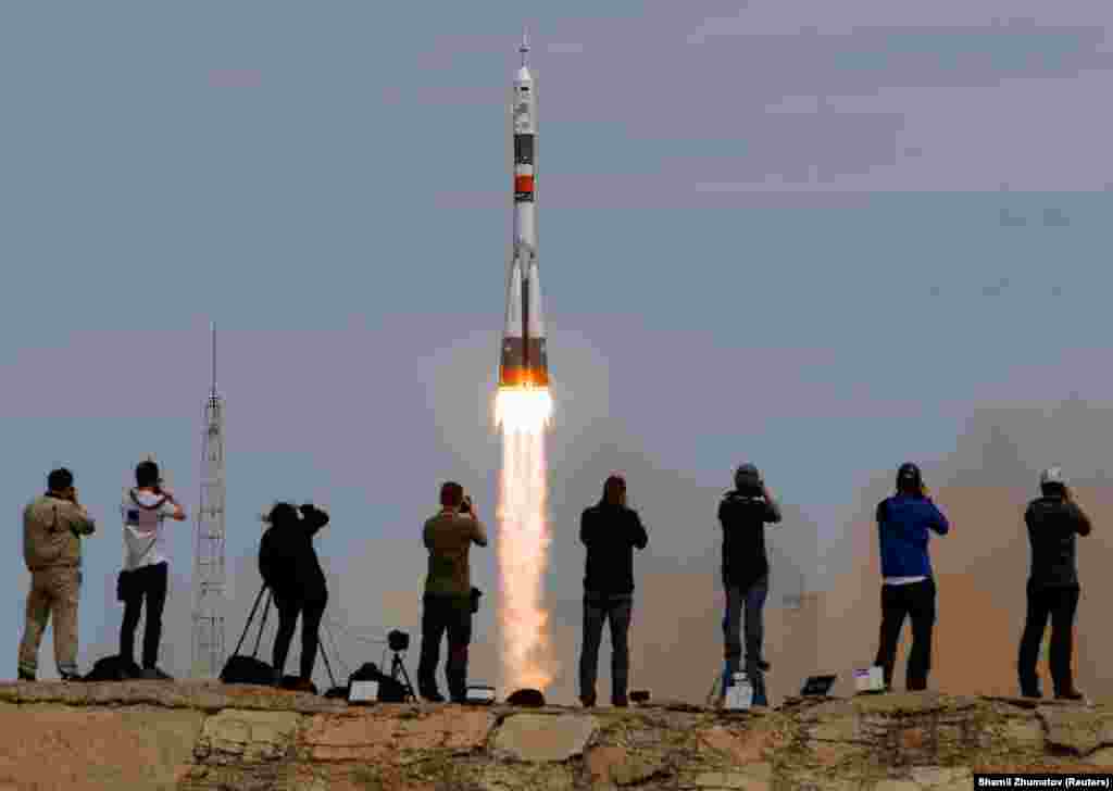 A Soyuz carrying one American and two Russians to the ISS blasts off in 2017. Travel blogger Ric Gazarian, who witnessed a launch in 2018, told RFE/RL that foreigners are allowed to watch the launch from a little more than a kilometer from the launchpad. &nbsp;