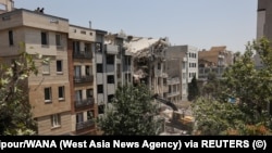 Iran - A building stands damaged in the aftermath of Israeli strikes, in Tehran, Iran, June 14, 2025. 