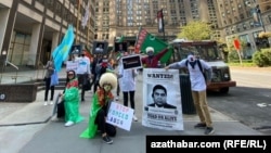 Turkmen opposition activists abroad, such as these demonstrating in New York, face pressure and threats to relatives back home.