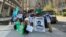 Turkmen opposition activists abroad, such as these demonstrating in New York, face pressure and threats to relatives back home.