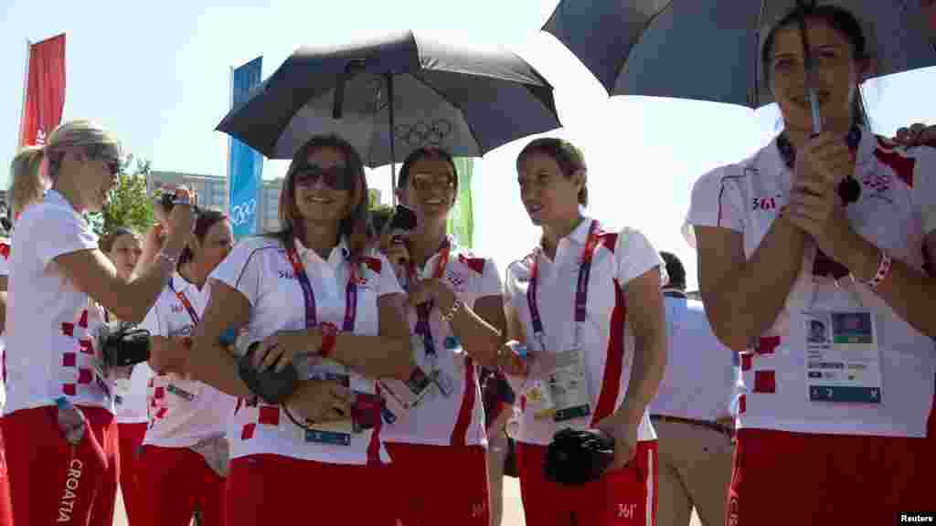 U.K. -- Members of Croatia's Olympic squad shade themselves during a welcoming ceremony in the Olympic Village before the London Olympic Games, 24Jul2012