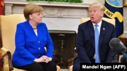 U.S. President Donald Trump and Germany's Chancellor Angela Merkel take part in a bilateral meeting in the Oval Office of the White House in Washington, April 27, 2018