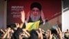"Hizbullah" lideri Seyid Həsən Nəsrullah Beyrutda tərəfdarlarına müraciət edərkən ekranda görünür.