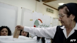 A Lebanese nun casts her ballot in ain the city of Zahleh. Christian voters are likely to be influential in the general election.