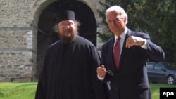 U.S. Vice President Joe Biden (right) talks with father Sava Janjic at the Visoki Decani monastery in May 2009.