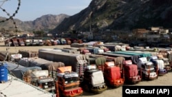 FILE: Trucks parked near the Pakistan Afghanistan border crossing in Torkham.