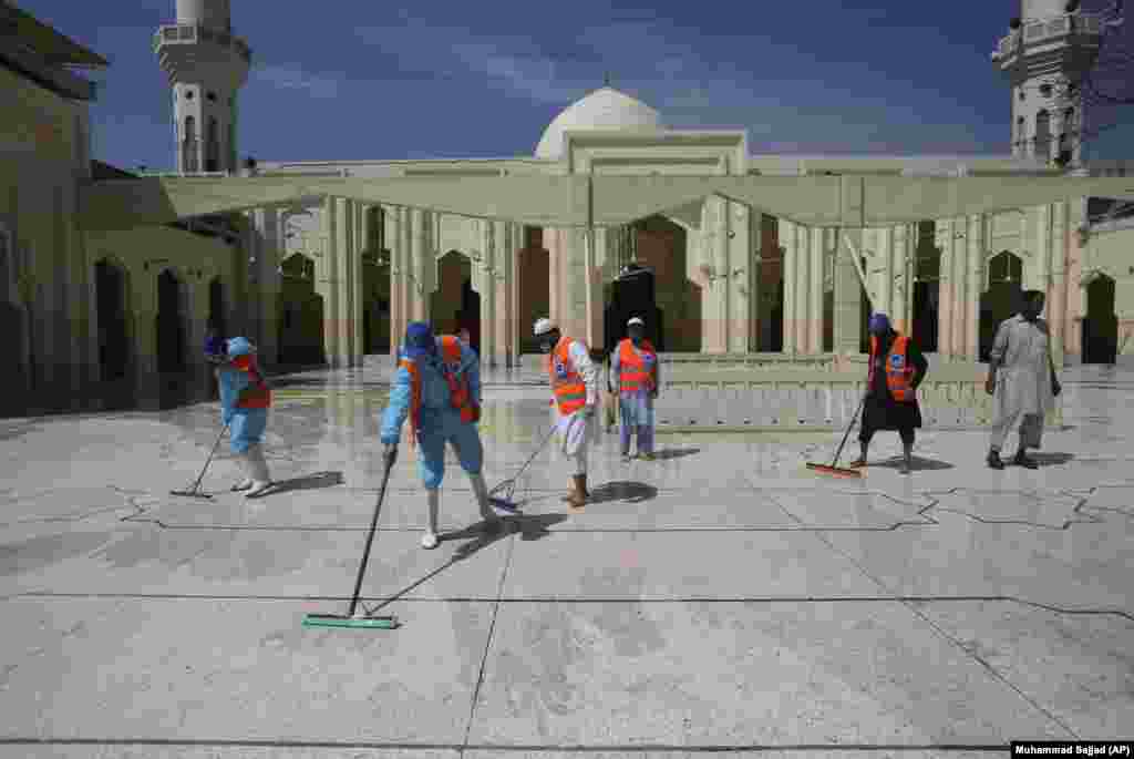 Volunteers disinfect a mosque ahead of the Muslim fasting month of Ramadan in Peshawar, Pakistan, on April 24.