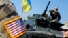 UKRAINE – A military instructor of the U.S. Army are seen near Ukrainian servicemen during multinational drills "Rapid Trident 2019" at the International Peacekeeping and Security Center near Lviv, September 24, 2019 