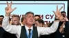 The Student List's lead candidate Ilija Srdanovic celebrates the news that Serbia's ruling party conceded defeat in parliamentary elections in Belgrade on October 25. 