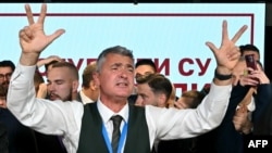 The Student List's lead candidate Ilija Srdanovic celebrates the news that Serbia's ruling party conceded defeat in parliamentary elections in Belgrade on October 25. 